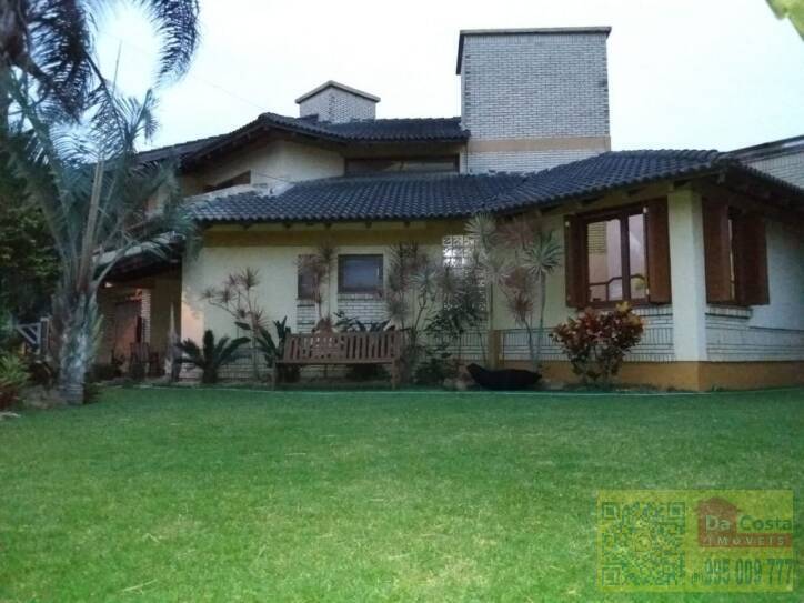 Casa com 4 dormitórios à venda, 408 m² por R$ 1.250.000,00 - Centro - Imbé/RS